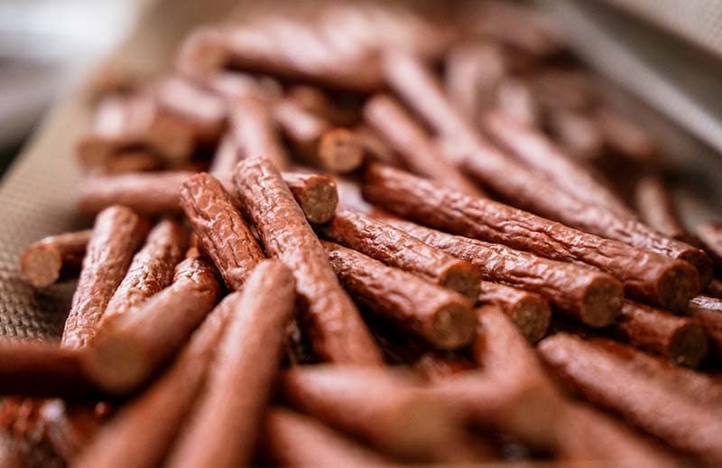 A pile of chopped beef sticks.